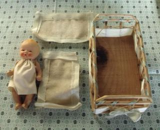 Miniature Antique Bisque Baby Doll in Original Cradle Nice